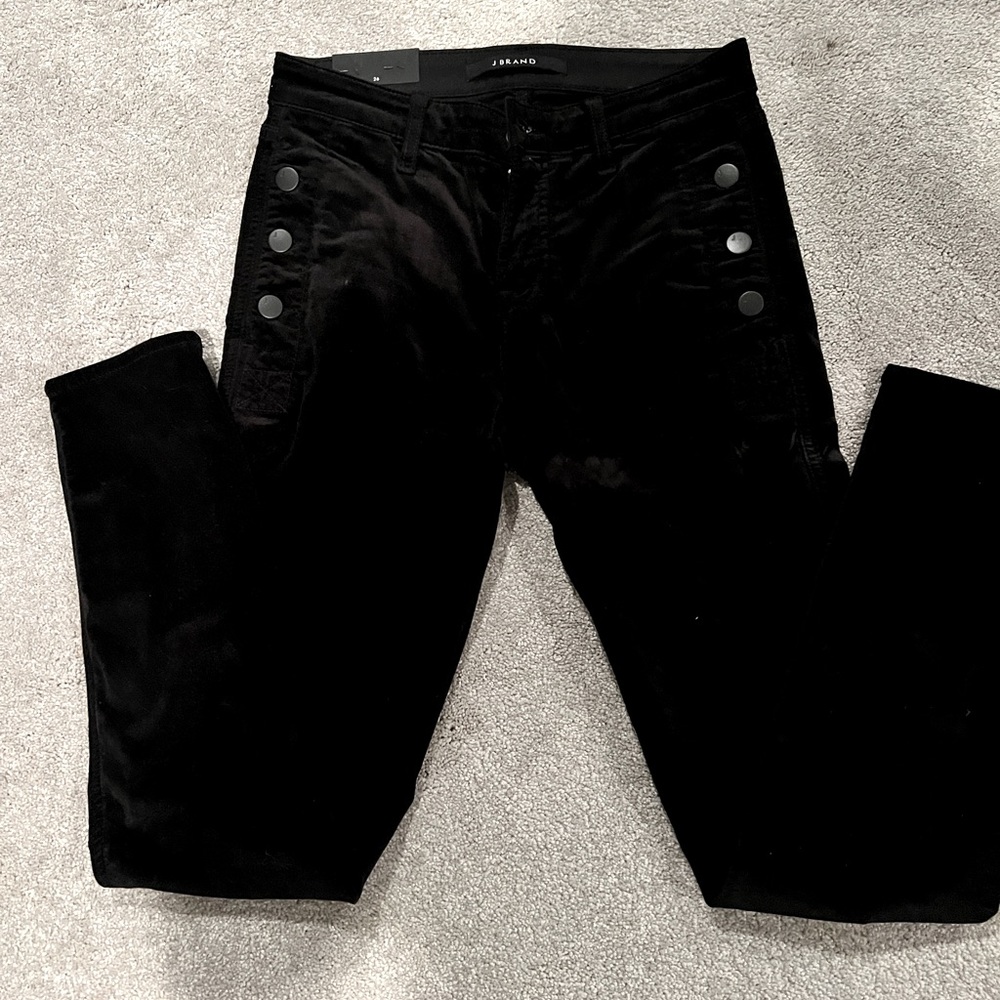 Brand new velour skinny jeans with buttons on each side. Front zipper.